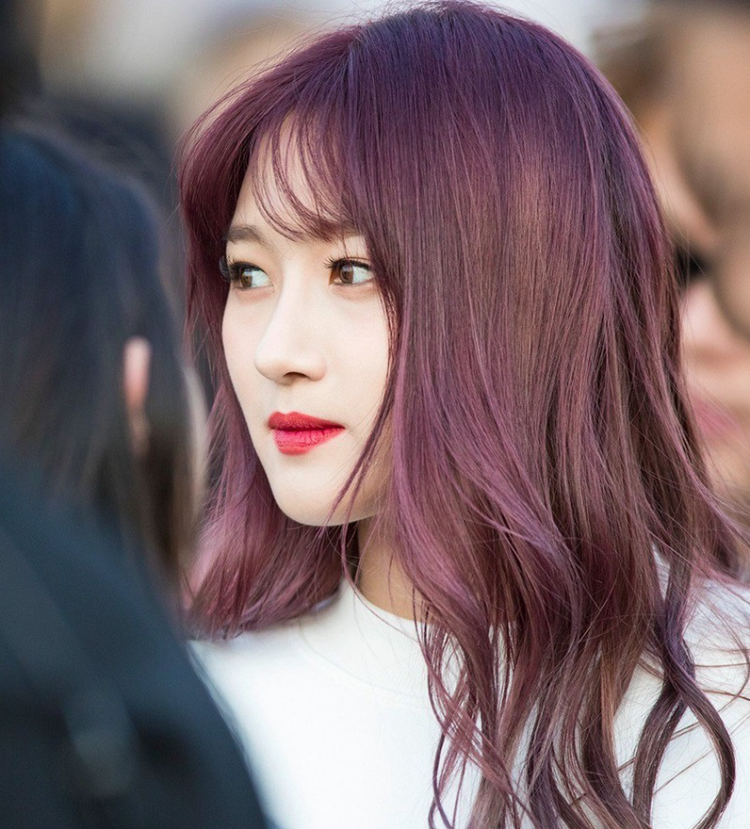 Purple-red hair lifts beautiful skin tone