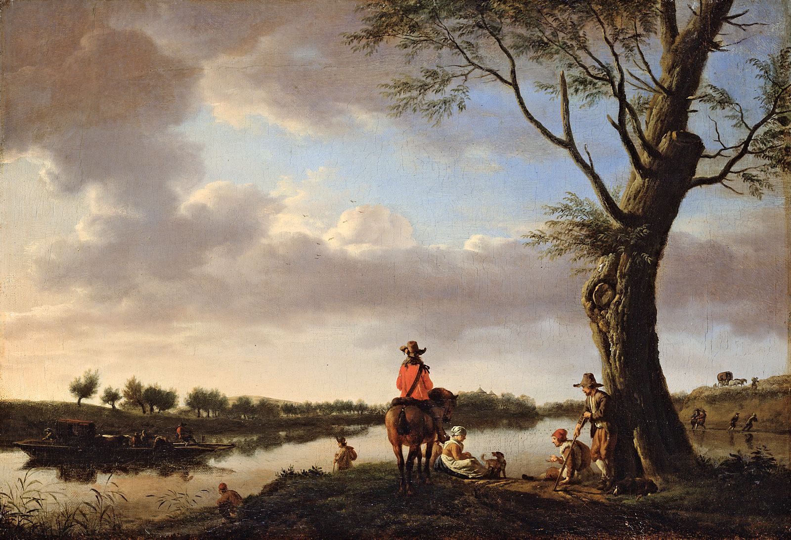 Bức ảnh chụp một nhóm người trên bờ sông dưới gốc cây