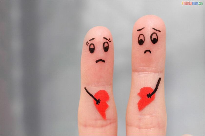 Finger art of couple. Couple holding broken heart.