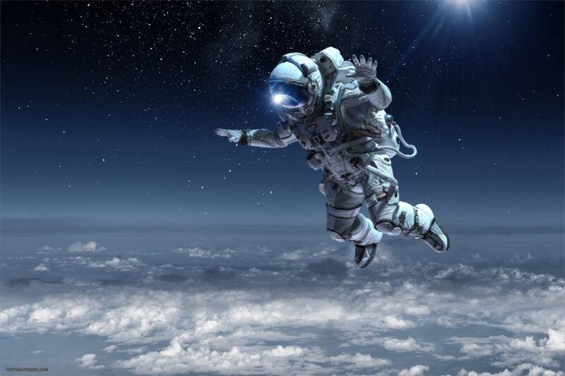 Astronaut,Floating,Above,Clouds